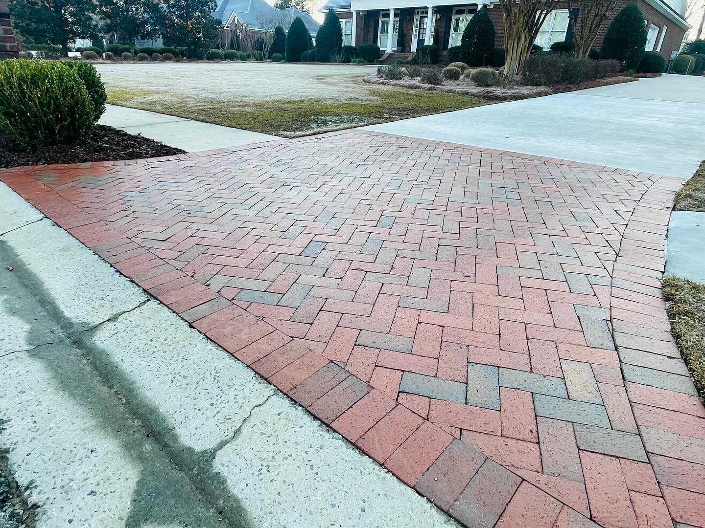 Herringbone brick paver driveway