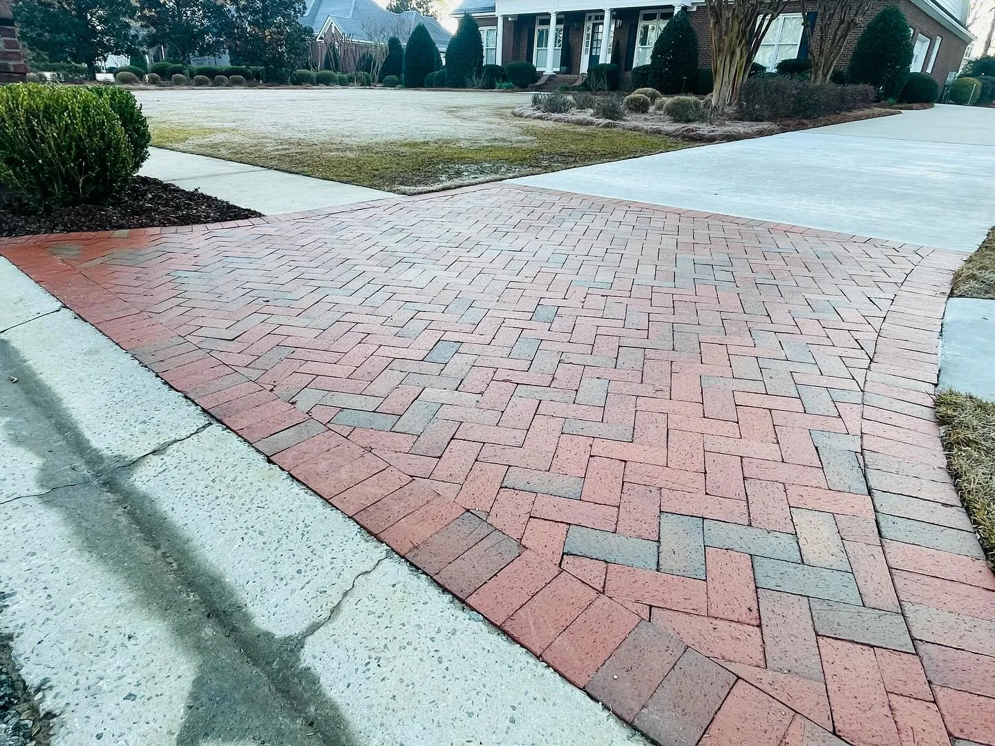 Herringbone brick paver driveway