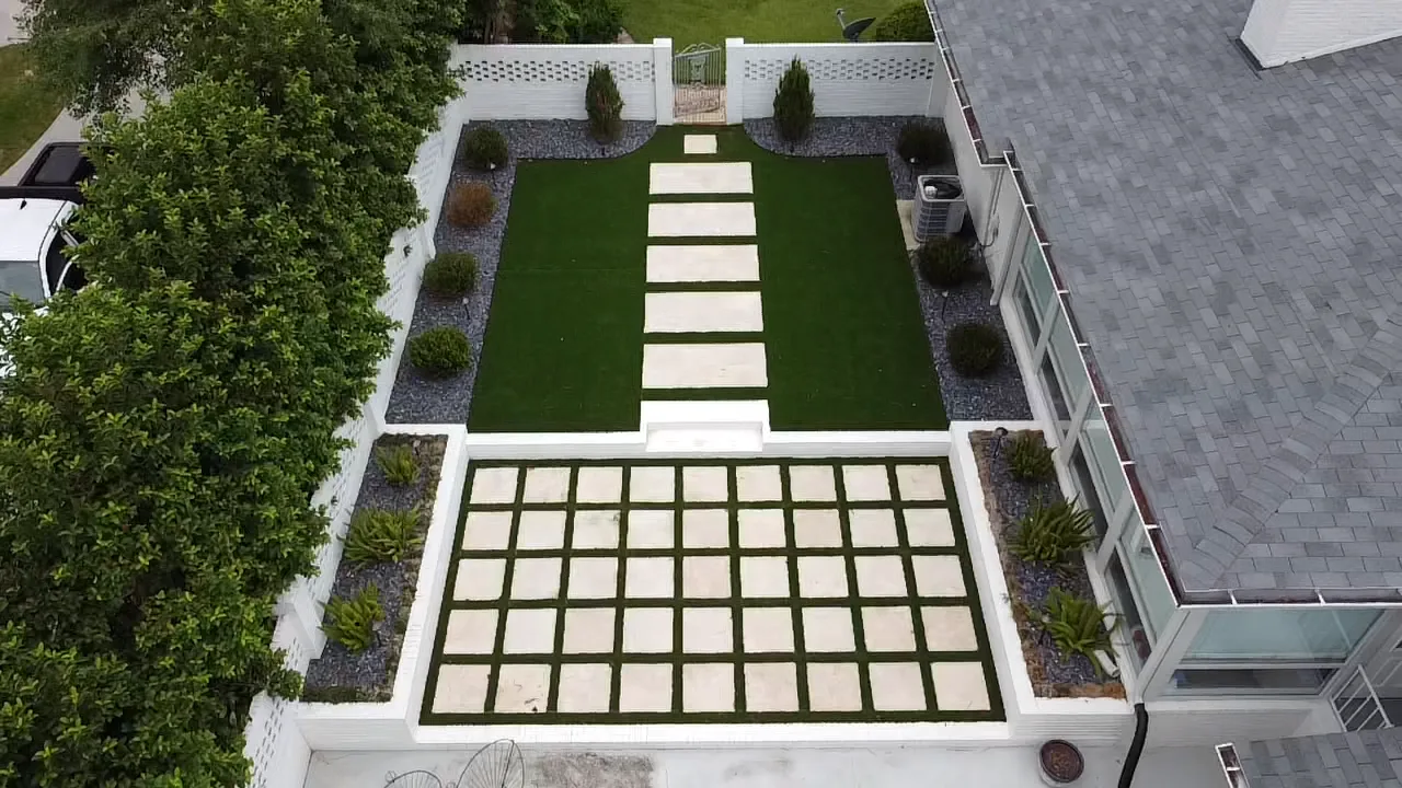 Modern courtyard with synthetic turf and stepping stone grid in Valdosta GA